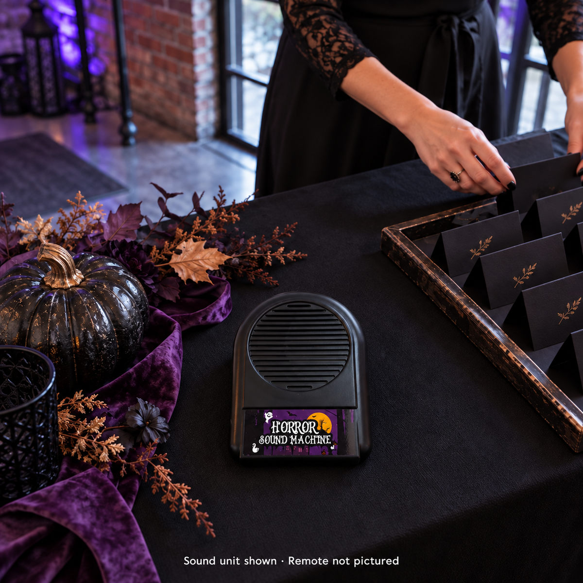 Things That Go Bump sound unit on a styled party-arrival console; included remote not pictured, other scene items not included.