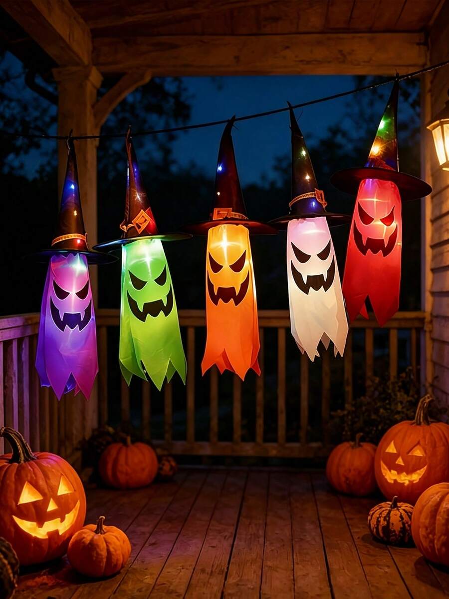 Five hanging black witch hats with multicolour LED lights
