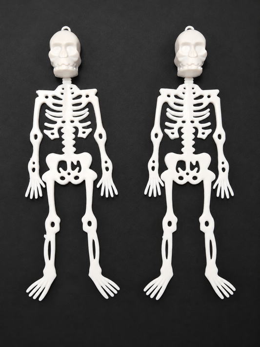 Retouched photo of actual stock: two white plastic skeletons