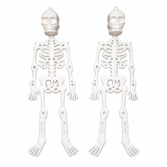 Bare Bones: two white plastic skeleton decorations on white; background edited from the owner’s actual product photograph.