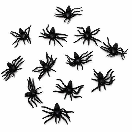 Small but Creepy: twelve black plastic spiders on white; background edited from the owner’s actual product photograph.