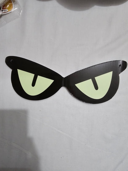 Unedited actual-stock daylight photograph of one assembled Somebody’s Watching eye decoration; the sale set contains four decorations. Original surface, folds and colour retained.