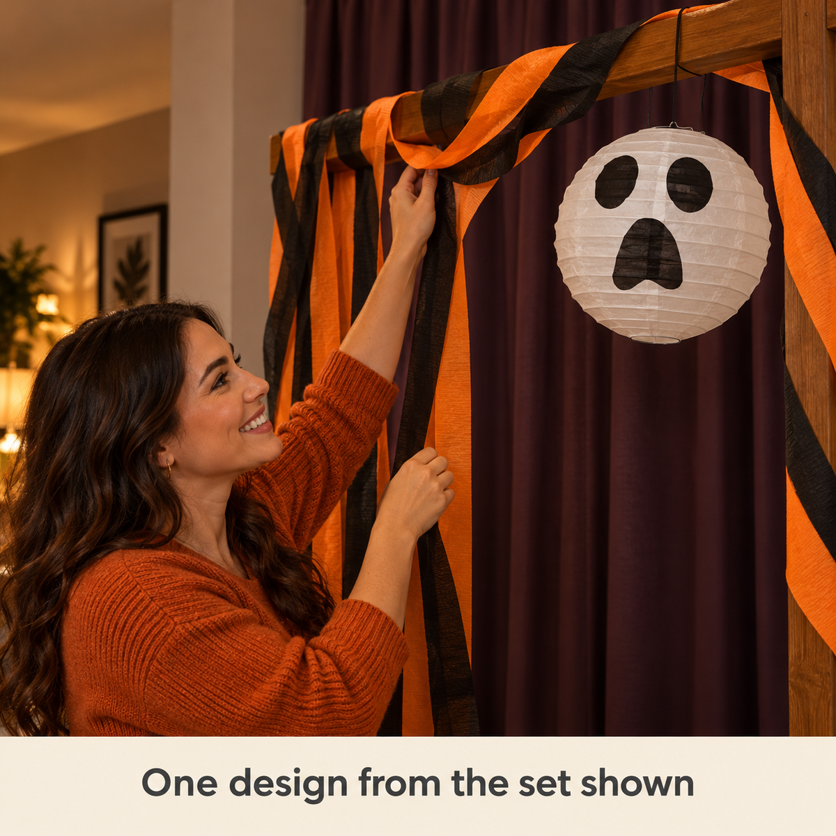 The Night Lights single unlit scared-face lantern on a styled party arch; one design from the six-lantern set, arch and other décor not included.
